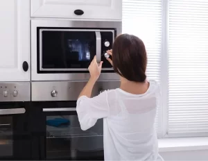 woman-removing-an-integrated-microwave